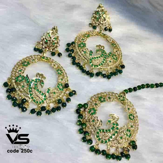 Wedding wear design by green jadau earrings with tika - Vijay & Sons