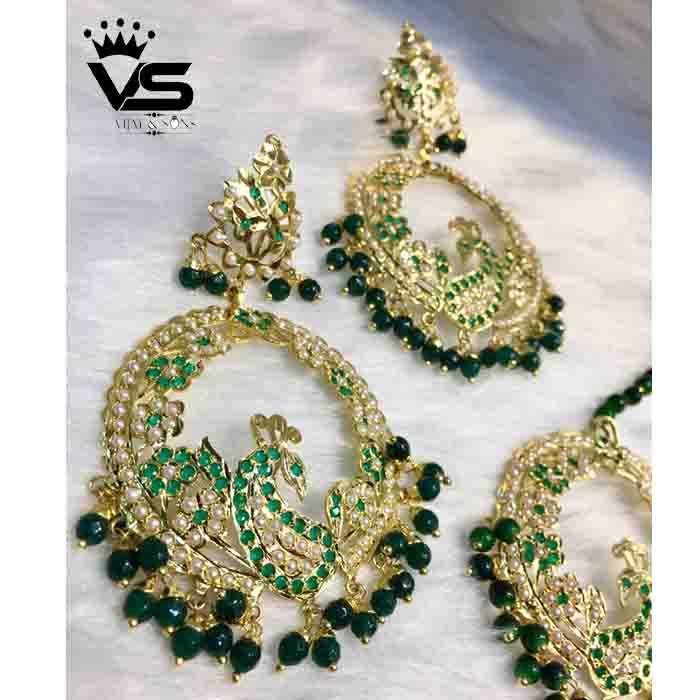 Wedding wear design by green jadau earrings with tika - Vijay & Sons