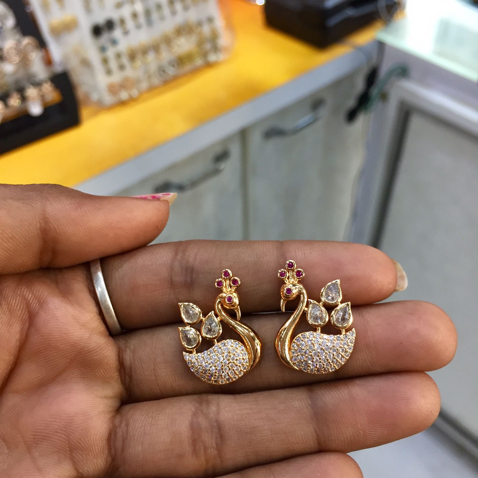 Beautiful swan earrings with stone embedded jumka  wwwsoosicoin